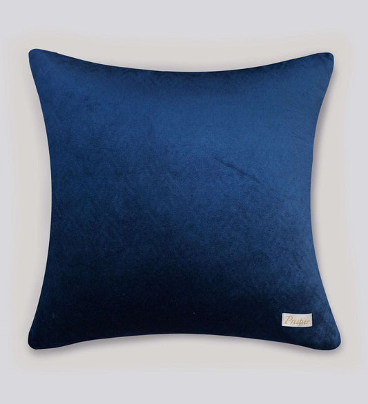 Blue pillow with a brand label on a white background