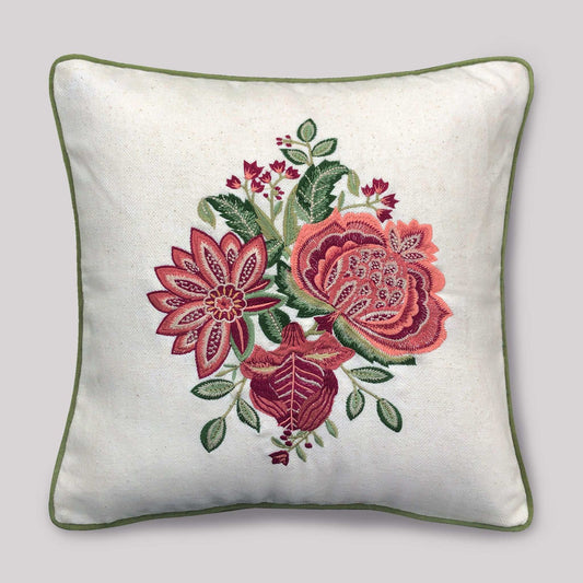 Decorative pillow with floral embroidery on a plain background