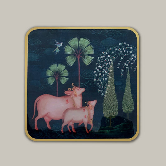 Luxury Pichwai coaster set styled on a dining table with coffee mugs and tea cups, modern handcrafted table accessories for home décor.