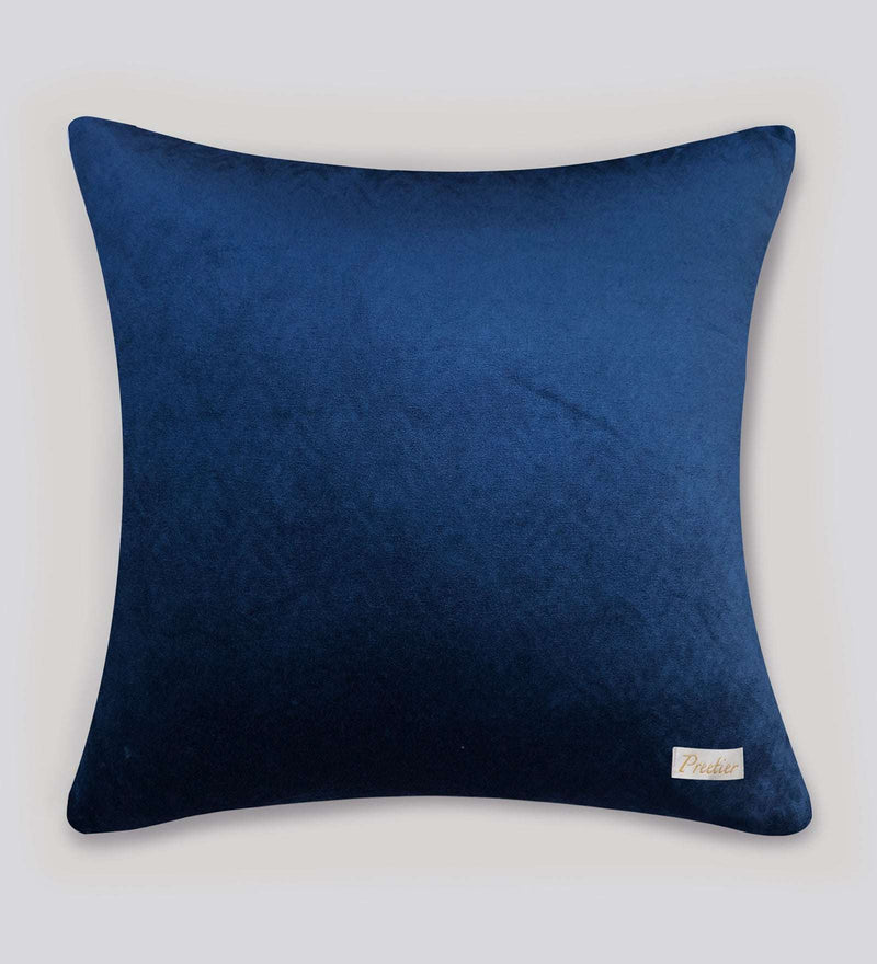 Blue pillow with a brand label on a white background