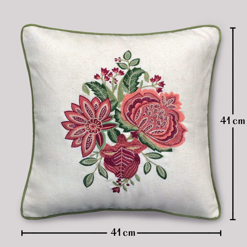 Decorative pillow with floral embroidery and measurements on a light gray background