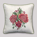 Decorative pillow with floral embroidery on a plain background