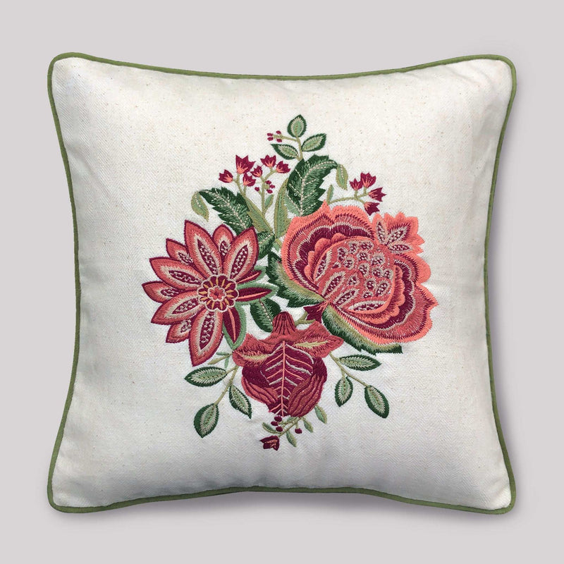 Decorative pillow with floral embroidery on a plain background