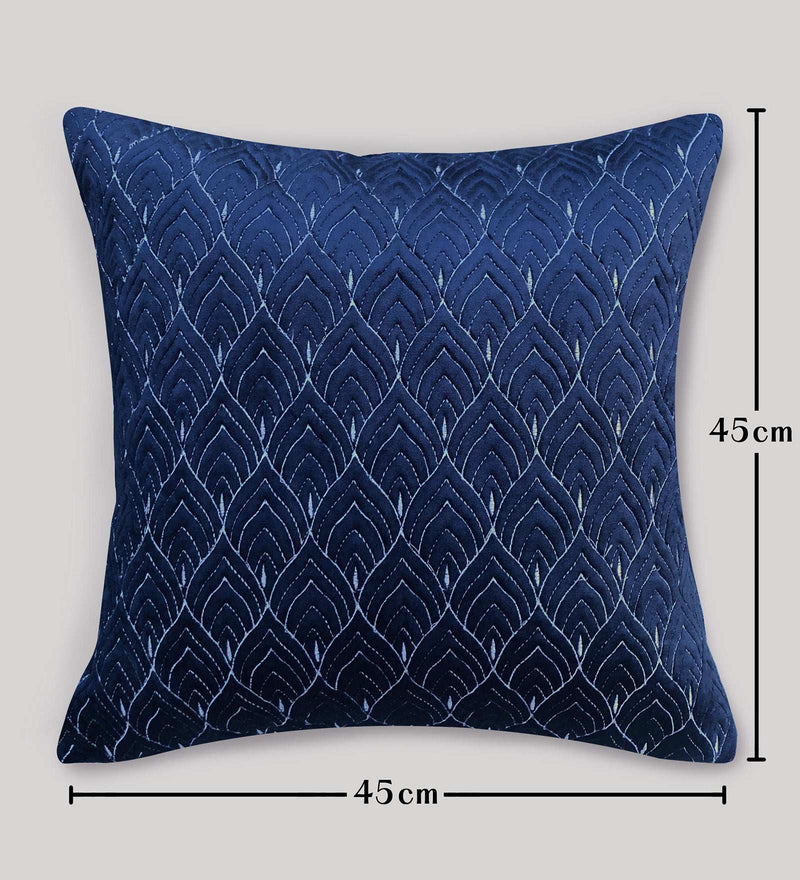 Blue textured pillow with dimensions on a gray background