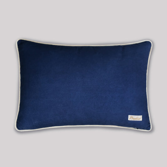 Close-up of hand-loomed Ikat weave showing characteristic blurry edges and navy blue dye details on cotton fabric.