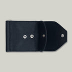 Black leather wallet with silver buttons on a light gray background