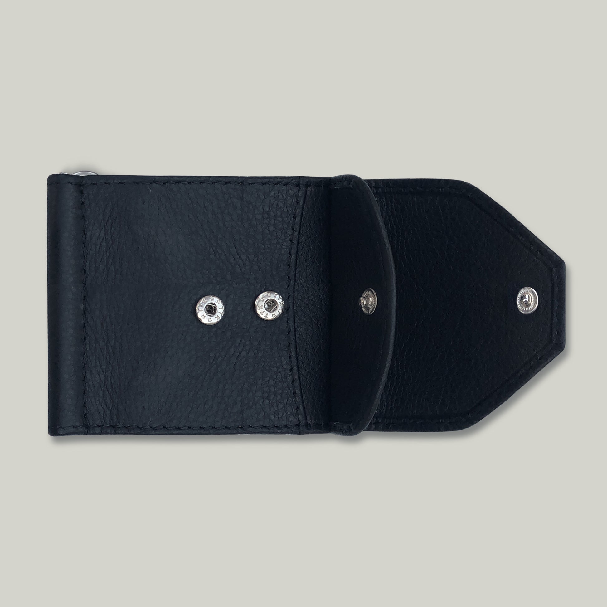 Black leather wallet with silver buttons on a light gray background