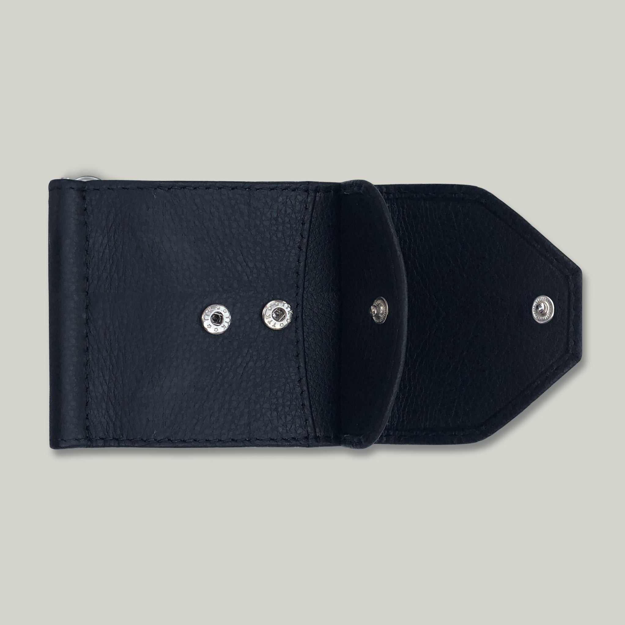 Black leather wallet with silver buttons on a light gray background