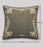 Decorative pillow with embroidered patterns on a gray background