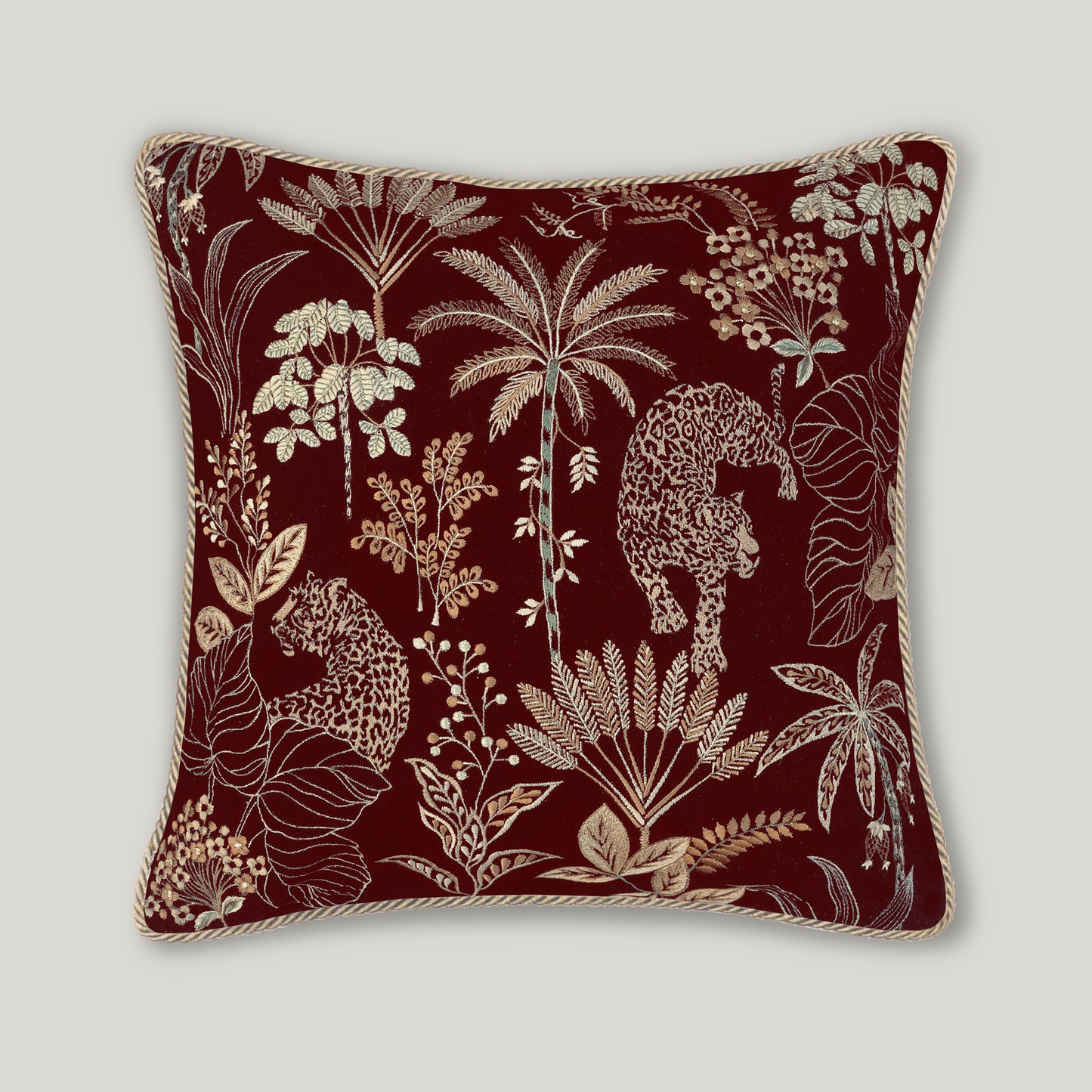 Selva Embroidery Cushion in rich burgundy velvet, featuring detailed decorative embroidery on a luxury wine-colored throw pillow.