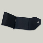 Minimalist men’s wallet in small-grain black leather with snap button closure