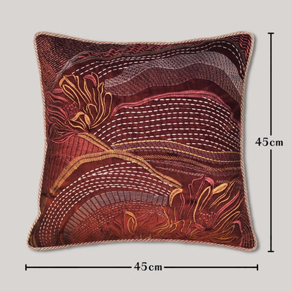 Velvet cushion handmade as an embroidered abstract landscape pillow, a textile art piece designed for bohemian decor and elegant living room styling.