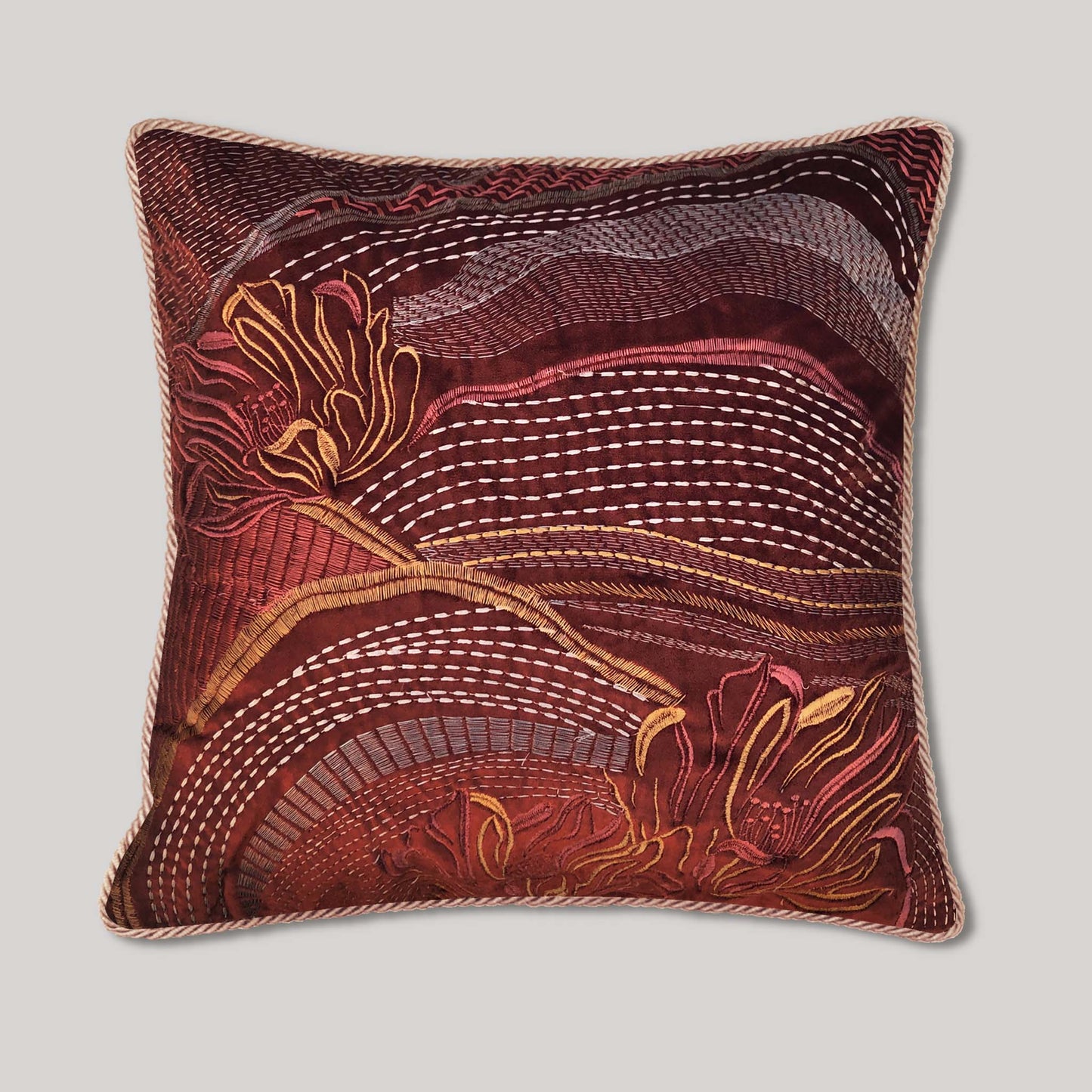 Handmade embroidered pillow cover featuring an abstract landscape floral embroidery on rust velvet, an earth tone bohemian accent pillow for living room home decor.