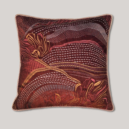 Handmade embroidered pillow cover featuring an abstract landscape floral embroidery on rust velvet, an earth tone bohemian accent pillow for living room home decor.