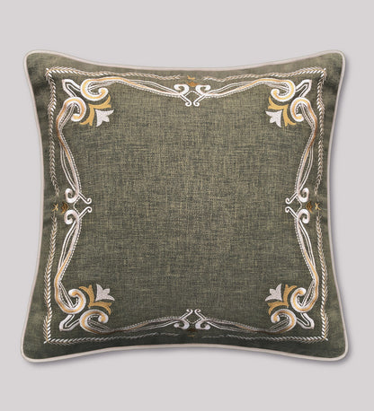 Luxury embroidered cushion cover in green with gold border, perfect for couches, beds, and accent chairs.