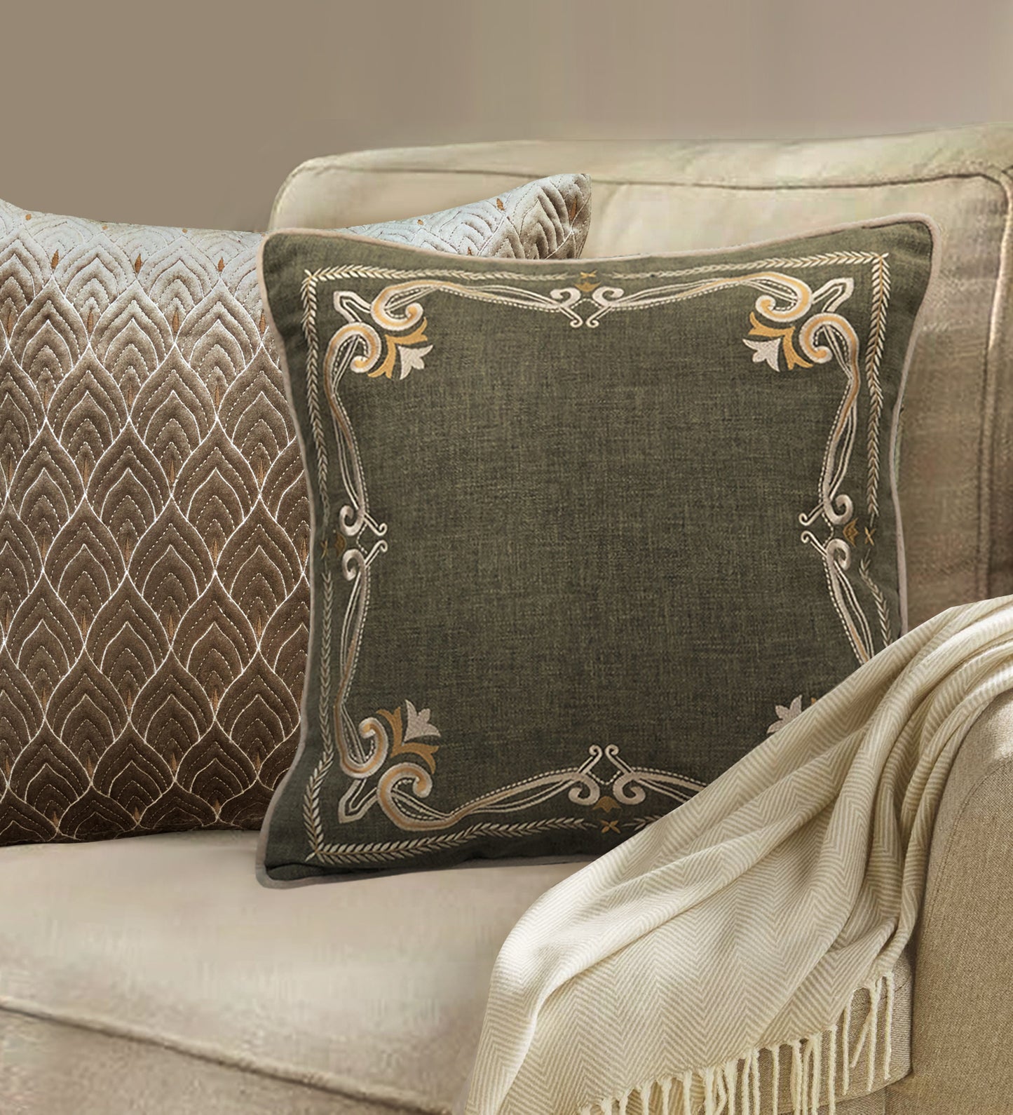 Green cotton cushion with gold embroidered border, styled as a luxury sofa pillow for modern living room decor.