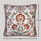 Luxury handcrafted cushion cover with intricate bird and floral Suzani design in rust and teal on white background — perfect for elegant living room or bedroom décor.