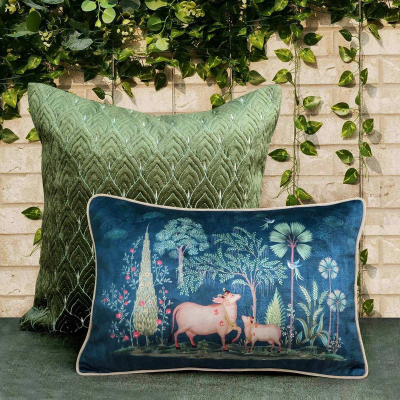 Plush velvet cushion cover with Indian cow and calf motif in deep blue, accented with botanical patterns, elegant luxury home decor piece
